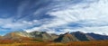 Blue sky and mountains, panorama. Royalty Free Stock Photo