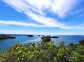 Blue sky and ocean meeting at the horizon overlooking Hundred Islands in the Philippines