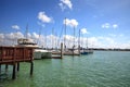 Blue sky over boats and sailboats at Factory Bay marina in Marco Island