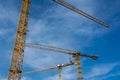 Blue Sky Over Construction Cranes Yellow Diagonal Copyspace Building Architecture Working Operation Frame Metal Royalty Free Stock Photo