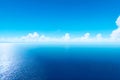 A blue sky over a flat and calm ocean. Copy space. Royalty Free Stock Photo