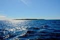 Blue sky over Lake Ladoga. Blue water sparkles from the sun. Royalty Free Stock Photo