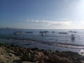 Blue sky over the ocean with fishing boats floating on sea. Sanur Beach, Bali, Indonesia