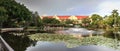 Blue sky over a pond and fountain at the Garden of Hope and Courage