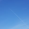 Blue sky with plane contrail