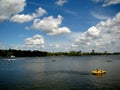 Blue sky, puffy clouds, hydro bicycles and clean water Royalty Free Stock Photo