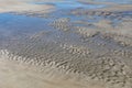 Blue sky reflected in tide pools on the beach, Tybee Island Georgia, USA Royalty Free Stock Photo