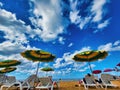 Blue sky and sea at the horizon. Colored umbrella on the beach Beach umbrellas on the beach. Umbrellas on a beach, beautiful beach Royalty Free Stock Photo