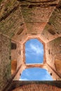 blue sky seen from inside an ancient medieval tower used as a pr Royalty Free Stock Photo