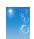 Blue sky with shining sun, flying soap bubbles and stars Royalty Free Stock Photo