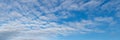 Blue sky with small white cumulus clouds, copy space Royalty Free Stock Photo