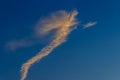 Blue sky with smoke contrail from a rocket or airplane. White cl