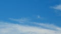 Blue sky soft silky clouds. Background of sky and clouds. Cirrus clouds in blear bright summer day. Time lapse. Royalty Free Stock Photo