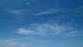 Blue sky soft silky clouds. Background of sky and clouds. Cirrus clouds in blear bright summer day. Timelapse. Royalty Free Stock Photo