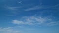 Blue sky soft silky clouds. Background of sky and clouds. Cirrus clouds in blear bright summer day. Timelapse. Royalty Free Stock Photo