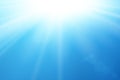 Blue sky sun flare background. Clear summer nature, sunlight weather. Sunshine glare rays, lens. Light sunny spring Royalty Free Stock Photo