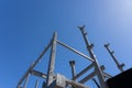 Blue sky and sun over structural steel construction framing