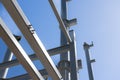 Blue sky and sun over structural steel construction framing