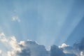 blue sky sun rays from behind the clouds, Sun rays behind cloud Royalty Free Stock Photo