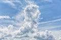 Blue sky on a sunny day. Cloud in the form of a candle. Space for text. Background Royalty Free Stock Photo