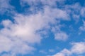 Blue sky in sunny day with white puffy clouds. Natural background Royalty Free Stock Photo
