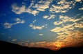 Blue sky and sunset with peacefull cotton clouds Royalty Free Stock Photo