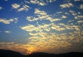 Blue sky and sunset with peacefull cotton clouds Royalty Free Stock Photo