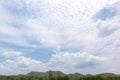 Blue sky with trees, clouds and mountains, sky background image Royalty Free Stock Photo