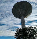 blue sky with umbrella shaped water tower