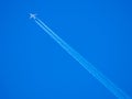 Blue sky vapour trails Royalty Free Stock Photo