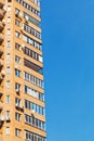 Blue sky and wall of brick multistoried house Royalty Free Stock Photo