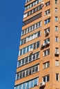 Blue sky and wall of multistorey house Royalty Free Stock Photo