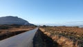 Mountain, road and Atlantic ocean near Vevang in Norway Royalty Free Stock Photo