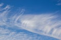 Blue sky with whispy lines of white clouds Royalty Free Stock Photo