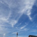 Blue sky white cloud tower
