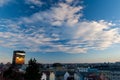Blue sky with white clouds above city Zagreb, Croatia. Landscape view of Zagreb during sunset. Evening reflection in a building. Royalty Free Stock Photo
