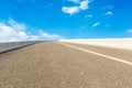 Blue sky white clouds and asphalt road Royalty Free Stock Photo