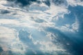 Blue sky with white clouds and curly dark rain clouds. Sky background. Royalty Free Stock Photo