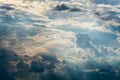 Blue sky with white clouds and curly dark rain clouds. Sky background. Royalty Free Stock Photo