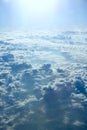 Blue sky with white clouds. Flight over clouds. Celestial abyss