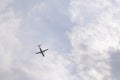 Blue sky with white clouds and a flying plane. View from the top Royalty Free Stock Photo