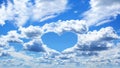 Blue sky with white clouds, love theme background. Clear blue sky with heart-shaped clouds with space for text Royalty Free Stock Photo