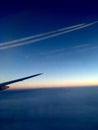 Blue sky and white clouds outside the window of the plane Royalty Free Stock Photo