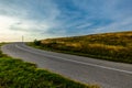 Sky with white clouds over empty asphalt road during Sunset Royalty Free Stock Photo