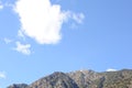 Blue sky with white clouds over mountain range on a sunny day in Andorra Royalty Free Stock Photo