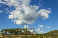 Blue sky with white clouds over an old farmhouse in Alcoy