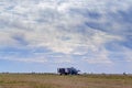 Beautiful blue sky with white clouds over wheat fields during harvest Royalty Free Stock Photo