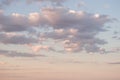 white clouds on a background of blue sky, pink sunset Royalty Free Stock Photo