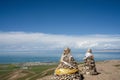 The blue sky and white clouds beside Qinghai Lake, as well as some tents and prayer flags on the grassland Royalty Free Stock Photo