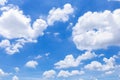 Blue sky with white clouds, rain clouds on sunny summer or spring day for background design Royalty Free Stock Photo